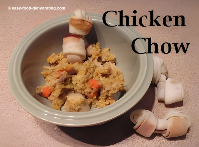 A bowl of homemade chicken chow dog food with a dog chew bone